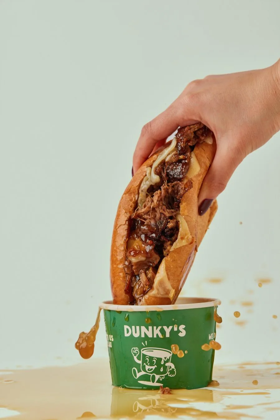 The OG Brisket roll with melted provolone, dripping after a dunk